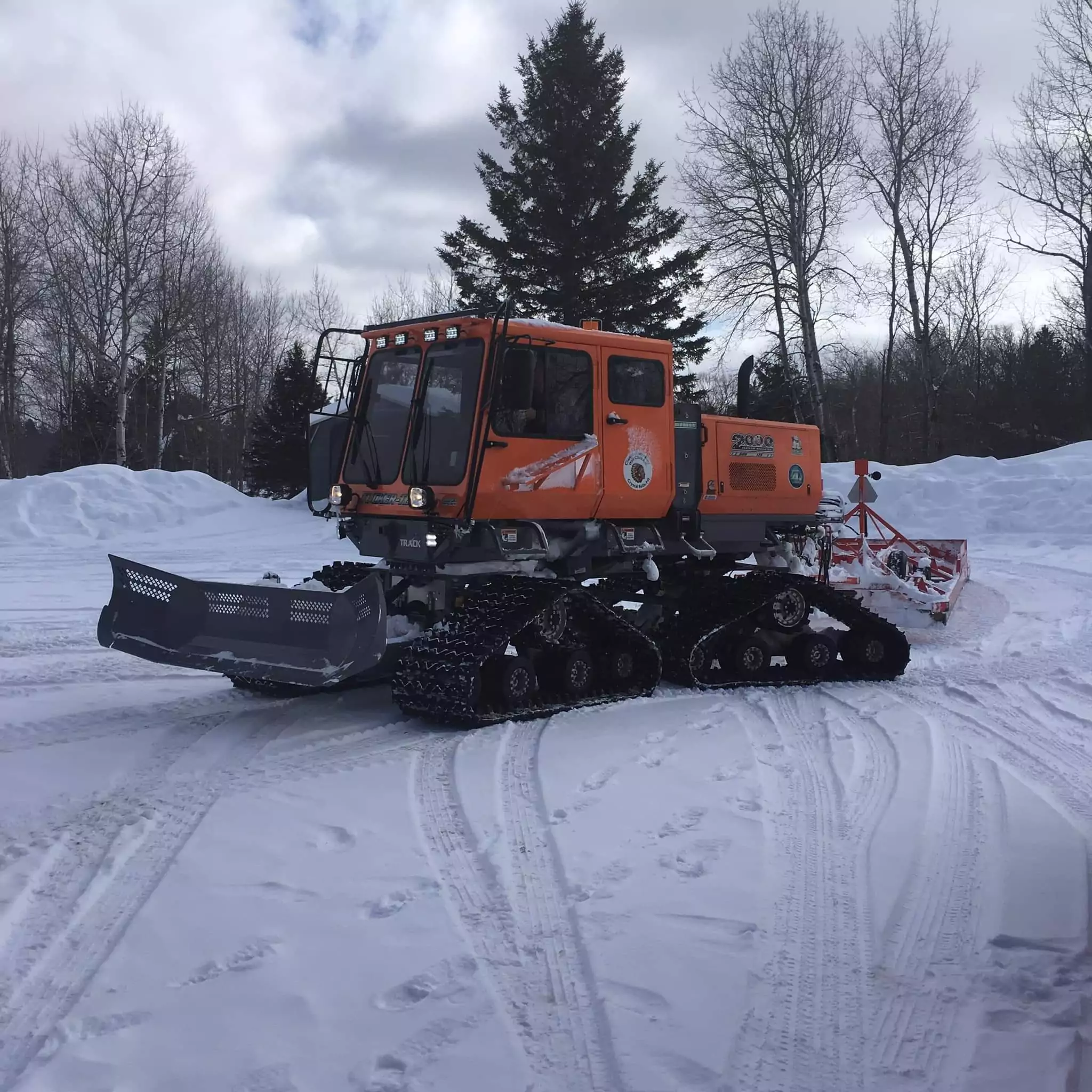 Trail groomer out on snow